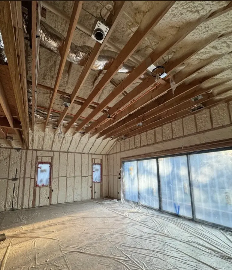 Interior walls and ceiling insulated with spray foam during new construction in Forestbrook